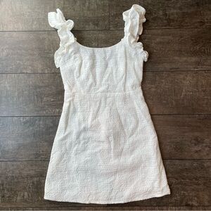 White embroidered mini dress with ruffle shoulder strap